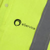 A bright yellow unisex polo shirt with reflective grey detailing and a logo on the front.