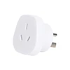 A white universal travel adapter featuring Australian and US plug configurations. It has a compact design and a branding logo.