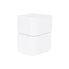 A white universal travel adapter kit featuring stacked compact sections, with a smooth finish and no visible branding.
