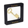 A square floating box displaying a gold key inside, framed in a black casing with a logo.