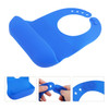 A blue silicone bib with snap closure featuring a wide pocket and adjustable neck. It has a logo on the side.