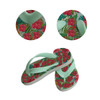 Rubber thongs in mint green with a vibrant floral print featuring pink flowers and tropical leaves.
