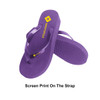 Purple rubber thongs with a textured sole and a logo on the strap.