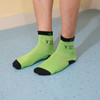 Bright green ankle socks with black accents, featuring a logo and custom pattern design. Ideal for casual wear.