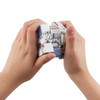 A 3x3 puzzle cube in hands, featuring various colourful designs and a logo.