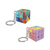 A set of colourful 3x3 puzzle cubes attached to keyrings, featuring vibrant geometric designs in blue, pink, and yellow.