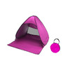 A pink pop-up beach tent with a matching carry bag, designed for sun protection.