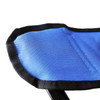 A close-up of a blue fabric surface with black trim, part of a portable camping chair. It has a simple design and stitching.