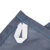 A close-up of a grey fabric with a white strap, featuring blue stitching and an attachment loop.