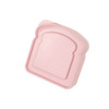 A pink portable lunch box shaped like a slice of bread, made from bamboo fibre, featuring a logo.