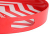 A red serving tray with a zigzag pattern and two cut-out handles. It has a glossy finish.