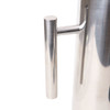A stainless steel pitcher with a sleek, polished finish and a cylindrical shape, featuring a simple handle.