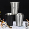 A drink bottle set featuring three stainless steel cups in silver and black, with a logo on one cup.
