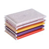 A stack of coloured pocket tissues in red, yellow, purple, and white packaging. The top tissue features a patterned design.