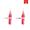 A lightweight pink umbrella with a wooden handle and a logo, secured with a fabric strap.