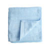 A folded, soft blue bamboo fiber towel, featuring a textured edge and a logo on one corner.