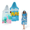 A set of two hooded towels in blue, featuring vibrant prints and a model wearing one design with a floral pattern.