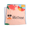A microfibre beach towel in peach colour featuring a crab, beach ball, and palm trees, with branding present.