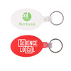 Two oval keyrings: one white with green text and one red with white text. Both have a metal ring attachment.