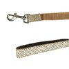 A detailed woven dog leash in brown with a patterned grip and a metallic clip for attachment.