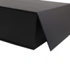 A large black foldable magnetic box with a triangular flap, featuring a smooth, matte finish and a logo.