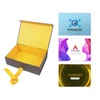 A medium foldable magnetic box in black with a yellow ribbon, alongside several business cards.