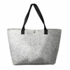 A grey felt shopping bag with black handles, featuring a logo on the side.