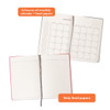 A B5 notebook with a cardboard cover, featuring monthly calendar pages and lined pages, in a pink and white colour scheme.
