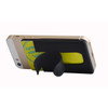 A black wallet stand attaches to a phone, holding a card, positioned against a light background.