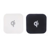 Square-shaped wireless chargers in black and white, featuring a logo on the surface.