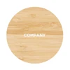 A circular bamboo wireless charger with a light wooden texture and a logo in the centre.