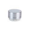 A silver metal Bluetooth speaker with a round design and control buttons on the base. It features a metallic grille on top.