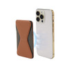 A brown and black PU MagSafe phone stand card holder next to a smartphone, featuring a logo on the holder.