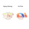 A butterfly-shaped acrylic phone pop holder and a custom-shaped holder with a multicoloured design, both with a clear base.