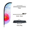 A convex feather banner featuring a pink flower design, with a pole, spike base, and carry bag included.