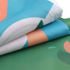A hexagon outdoor blanket measuring 280x210cm, featuring vibrant blue, green, and peach patterns. It has a logo.