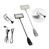 Two inclined display lights in black and grey, with clamps and cables included for setup.