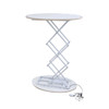 A backlit LED spring-up display table in white with a round top and a collapsible scissor mechanism.