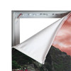 A large backlit LED light box display with a partially detached fabric cover, featuring various colours in the image.