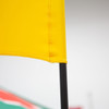 A yellow flag featuring a black pole, part of a larger promotional banner display.
