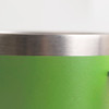 A green stainless steel mug featuring a metallic rim and a smooth surface. It includes a logo.