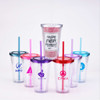 A collection of clear plastic cups with colourful lids and straws, featuring various logos.
