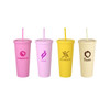 Four 24oz matte plastic cups in pink, purple, yellow, and cream, each with a lid and straw, featuring various logos.