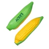 A corn-shaped stress reliever in vibrant green and yellow with a logo on one side.