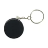 A keyring featuring a black hockey puck stress reliever with a metal chain attached.