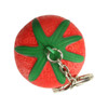 A red strawberry-shaped stress reliever attached to a silver keyring, featuring a green leaf top.