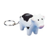 A keyring featuring a white and black cow-shaped stress reliever with a metal keyring attachment.