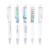 A selection of white plastic pens featuring colourful designs and clip mechanisms, all with branding.