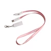 A pink polyester lanyard featuring a USB charging cable with multiple connectors and a clip attachment.