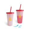 A drink cup with a red lid and straw, featuring a gradient colour change from clear to pink, and a logo.
